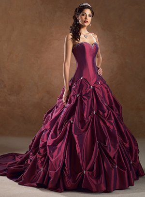 This is an image of a maroon wedding dress with silver